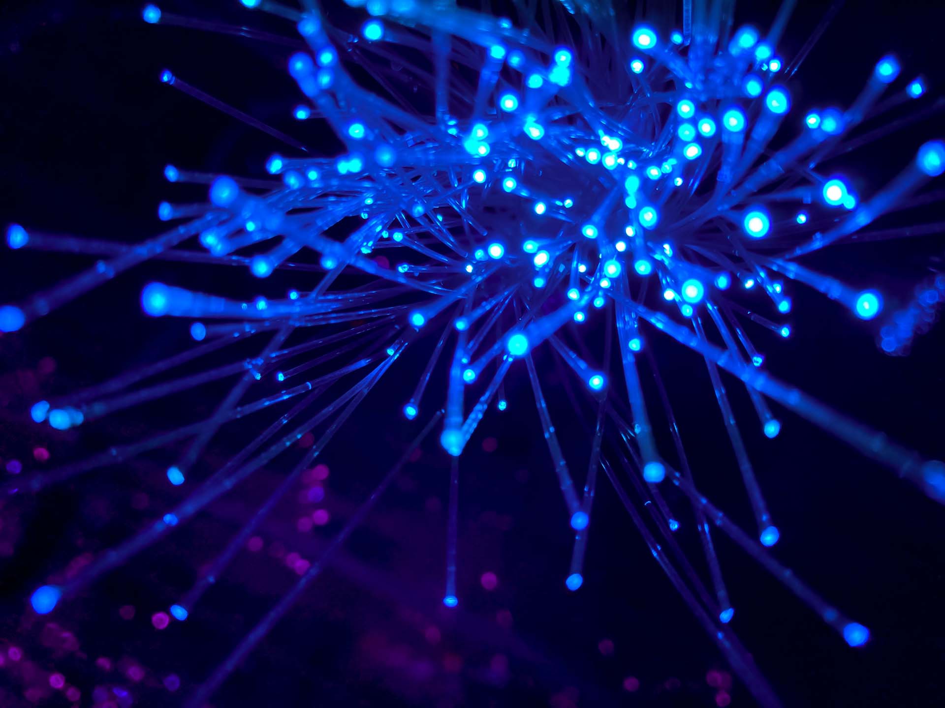 Abstract geometric shapes and flowing digital elements symbolising AI agents, automation, data processing and innovation in insurance operations.